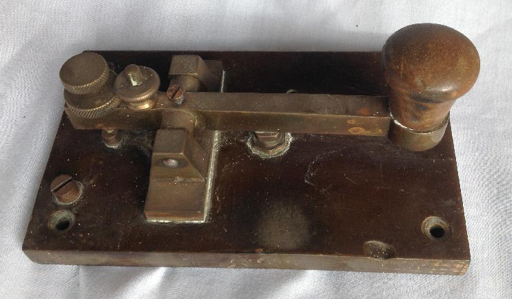 vintage brass and bakelite (or similar composition) morse key instrument
